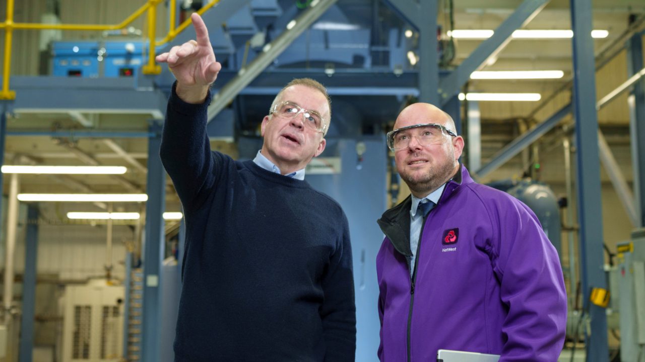 This image shows a NatWest colleague with a customer. 