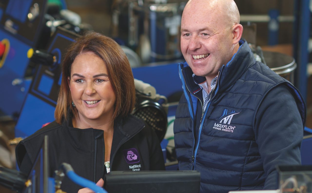 This image shows a NatWest Group colleague with a customer. 