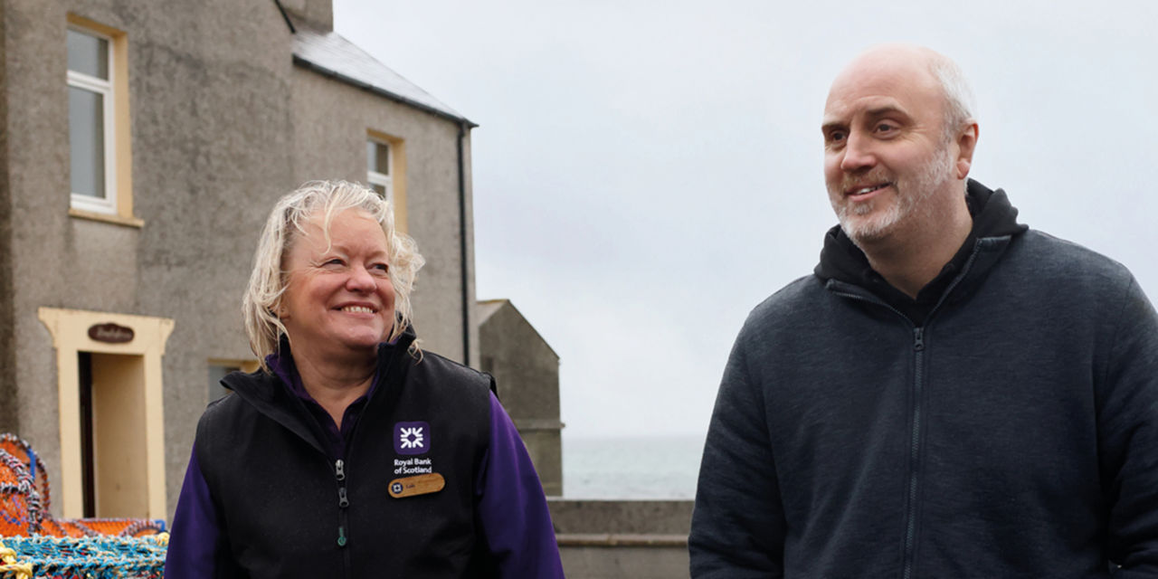Lois Canning, Personal Banker, and Stuart Groat, Royal Bank of Scotland customer in the Orkney Islands 