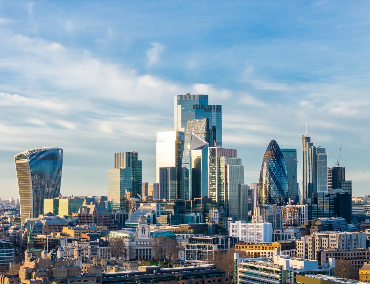 Image of aerial view of City of London skyline with modern skyscrapers and historic financial district with sky terrace, the Gherkin and others.