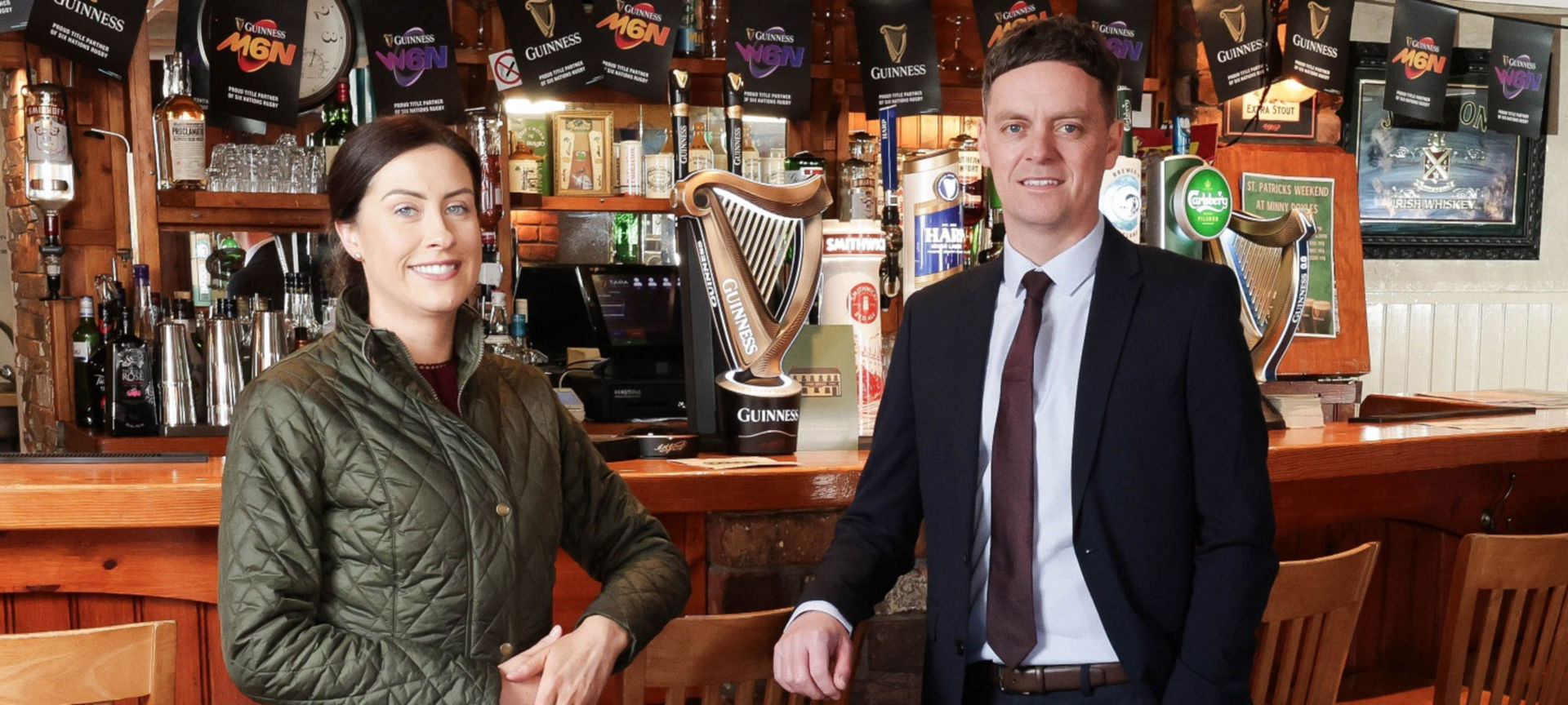 Image shows the new owners inside Minny Doyles pub
