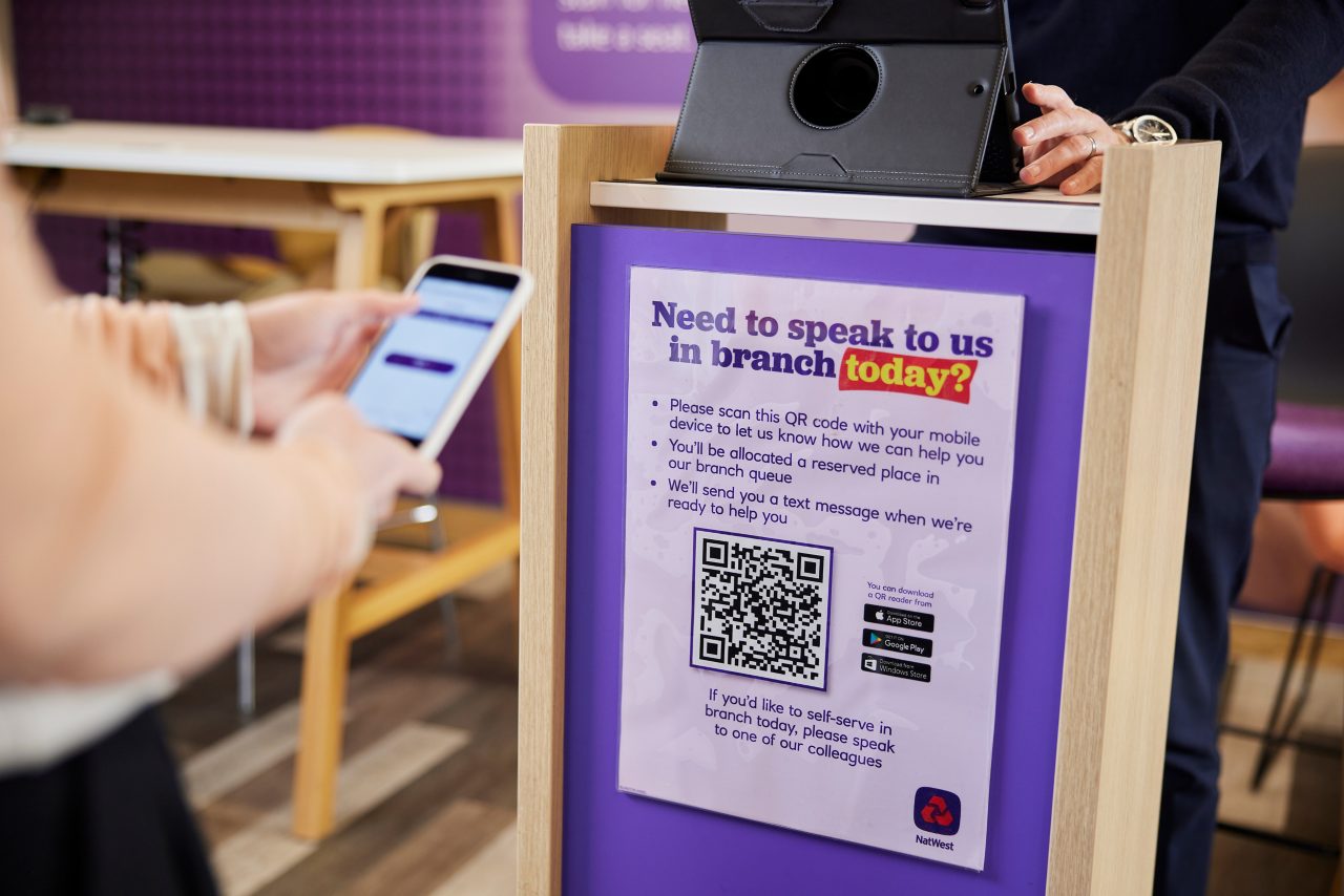 Phone scanning a QR code in branch