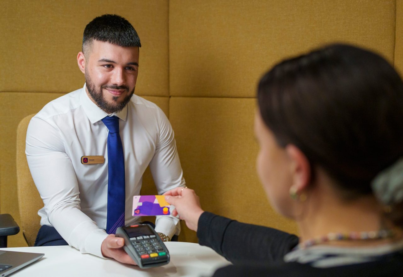 Natwest employee Imran takes a contactless payment from a customer at a Natwest branch at Grand Central Shopping Centre in Birmingham. Picture date: Wednesday May 15, 2024. Photo credit: Natwest/Dominic Lipinski